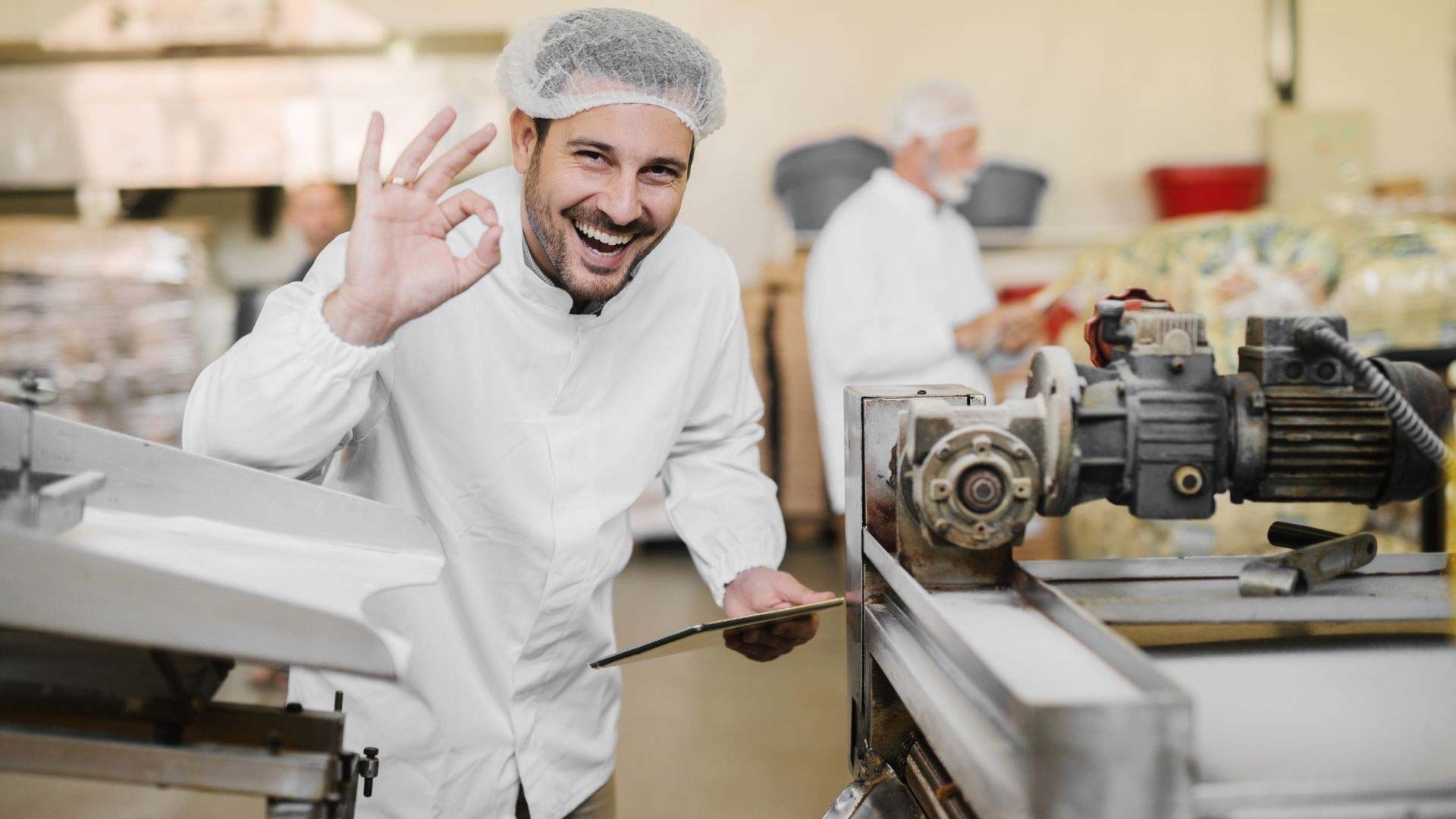 man smiling in a factory